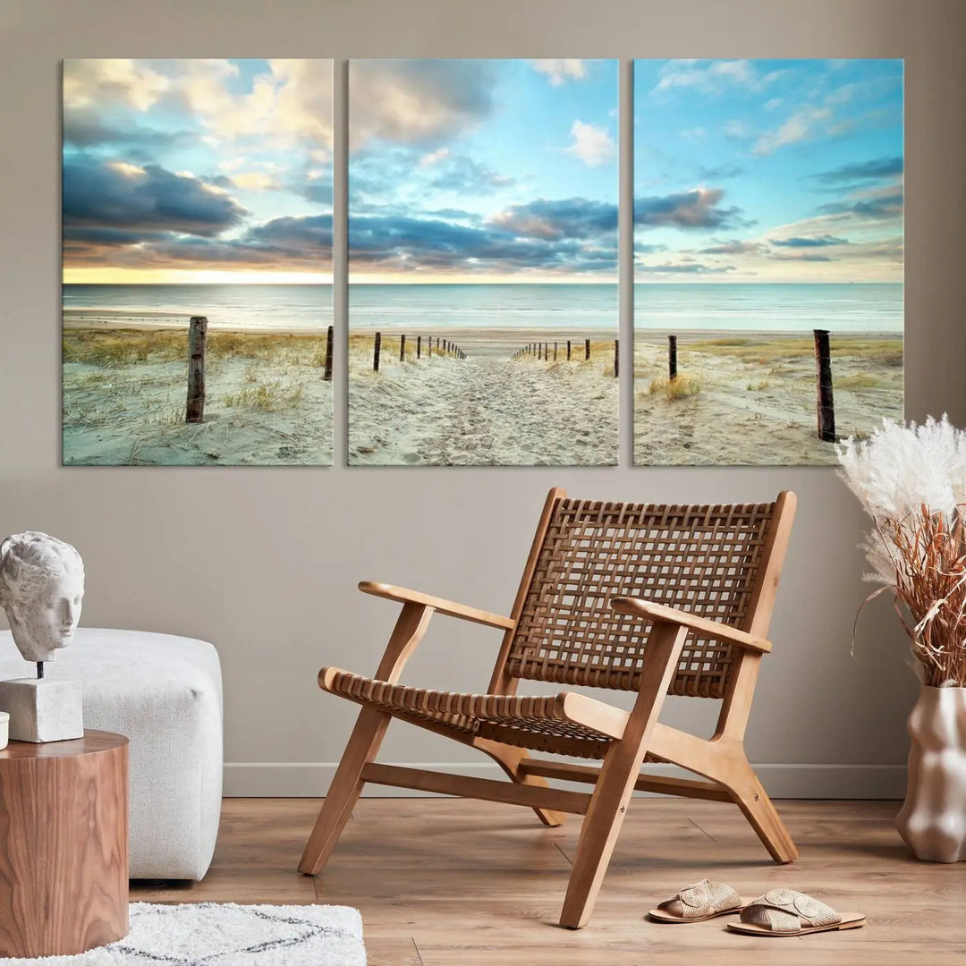 The Beach Ocean Sunset Sand Wall Art Canvas Print, renowned for its museum-quality and UV-protective coating, is elegantly displayed on a dark wall.