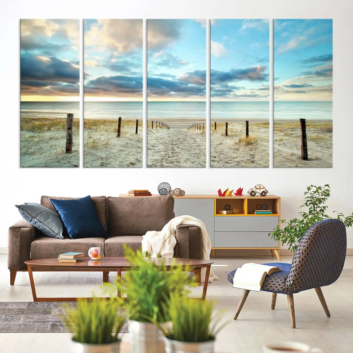 The Beach Ocean Sunset Sand Wall Art Canvas Print, renowned for its museum-quality and UV-protective coating, is elegantly displayed on a dark wall.