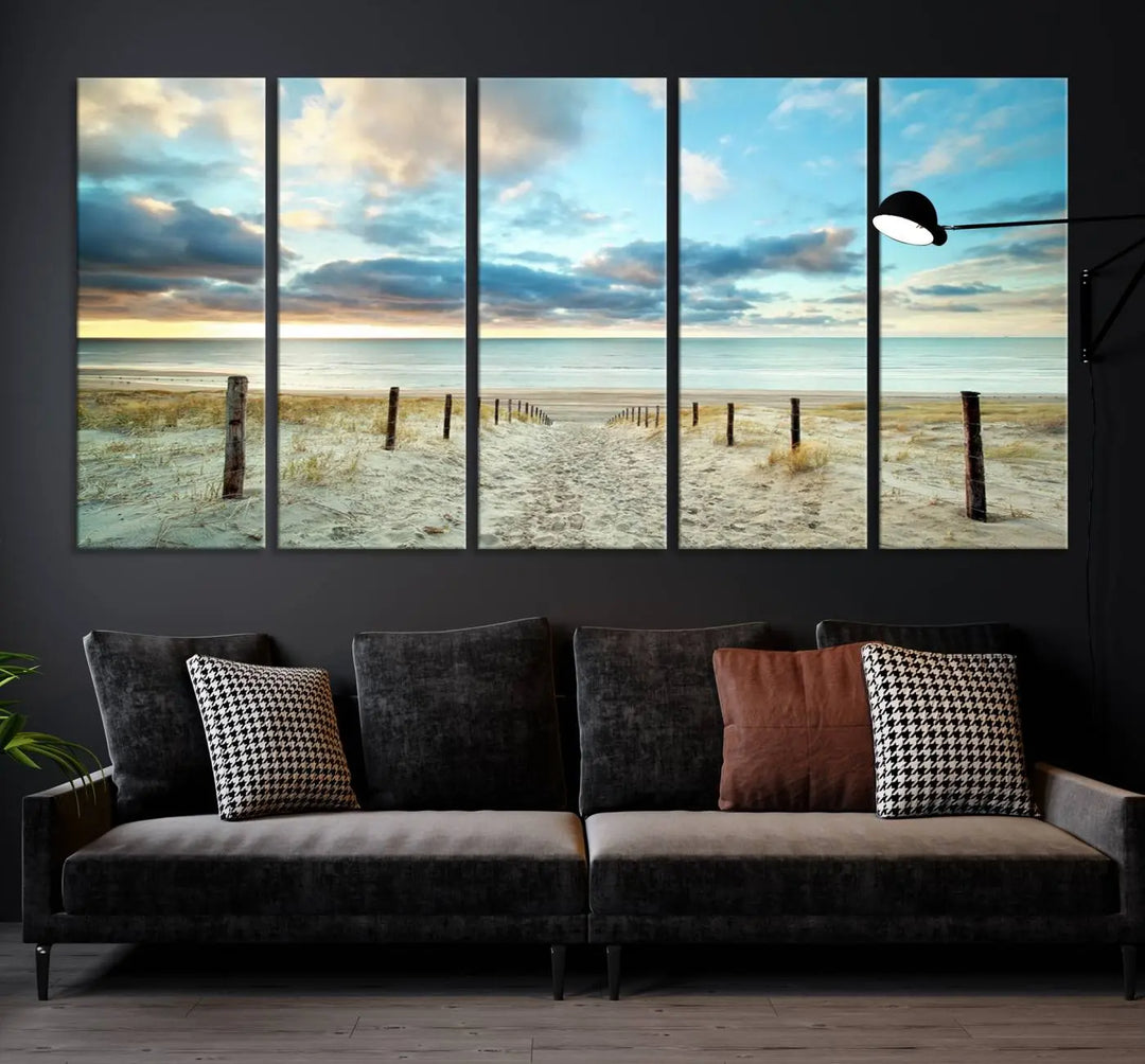 The Beach Ocean Sunset Sand Wall Art Canvas Print, renowned for its museum-quality and UV-protective coating, is elegantly displayed on a dark wall.