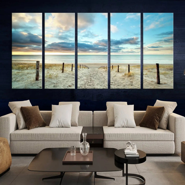 The Beach Ocean Sunset Sand Wall Art Canvas Print, renowned for its museum-quality and UV-protective coating, is elegantly displayed on a dark wall.