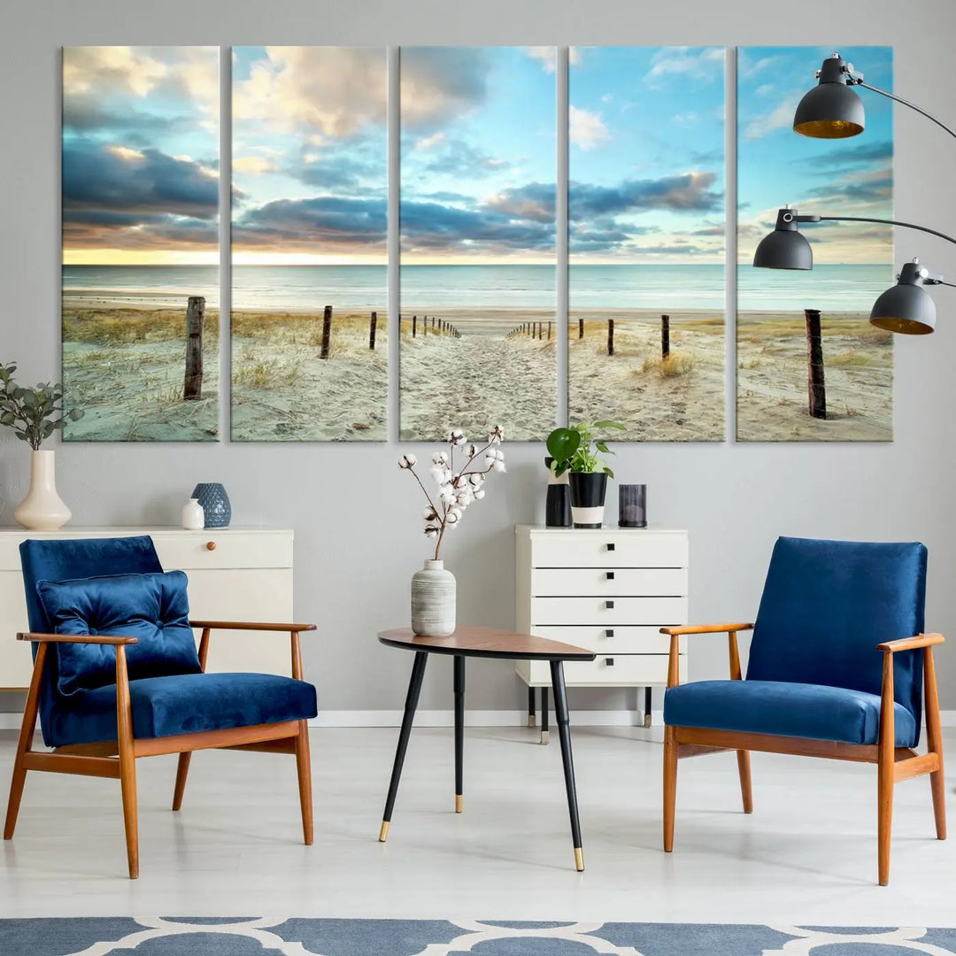 The Beach Ocean Sunset Sand Wall Art Canvas Print, renowned for its museum-quality and UV-protective coating, is elegantly displayed on a dark wall.