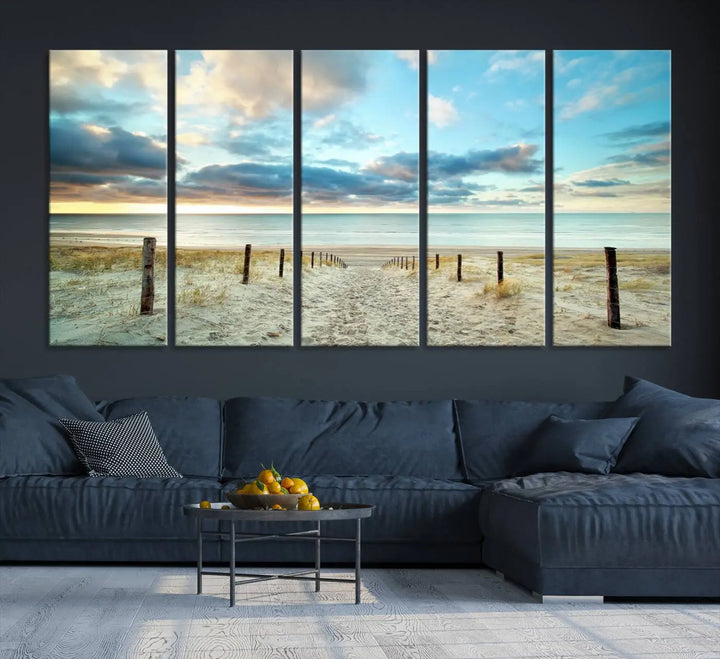 The Beach Ocean Sunset Sand Wall Art Canvas Print, renowned for its museum-quality and UV-protective coating, is elegantly displayed on a dark wall.