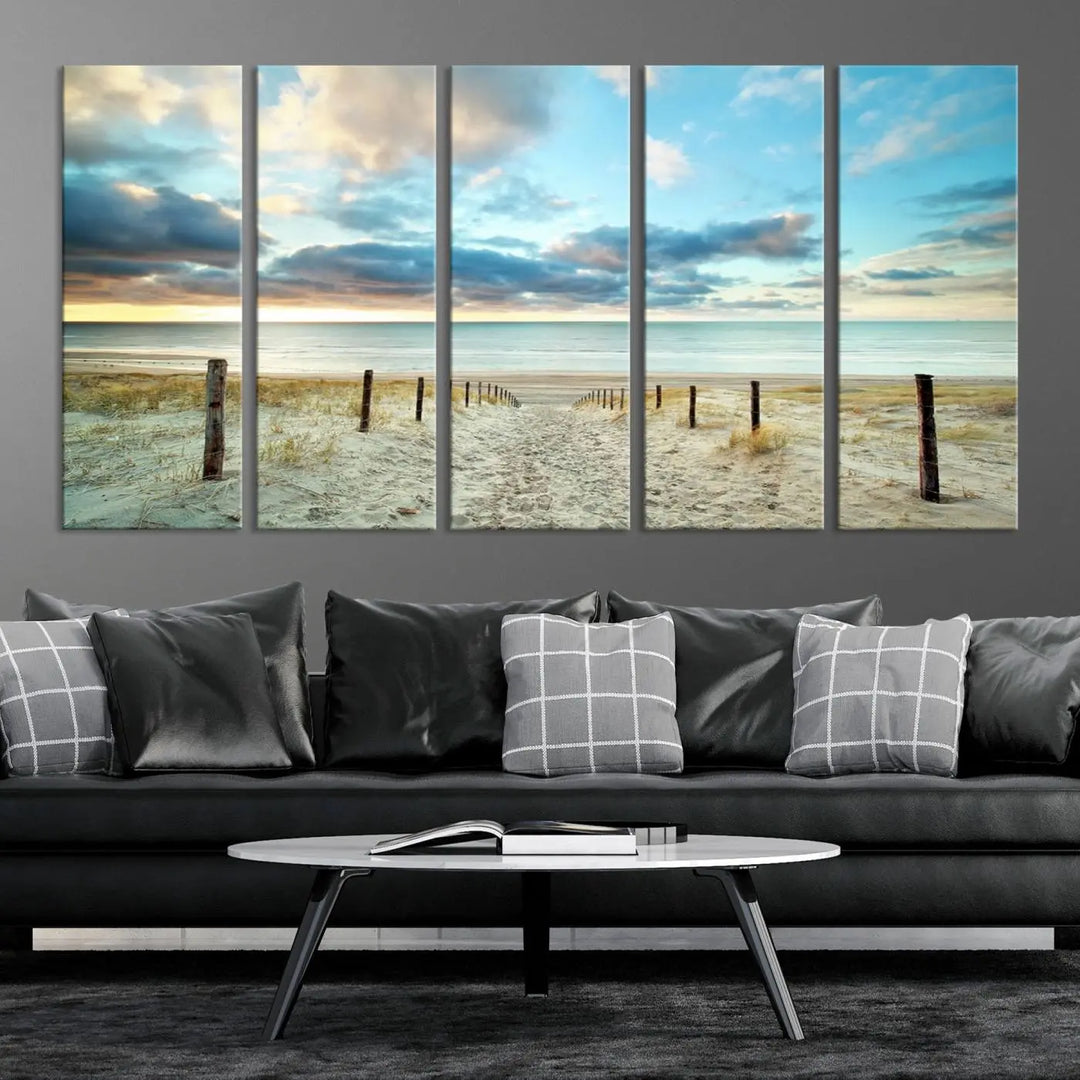 The Beach Ocean Sunset Sand Wall Art Canvas Print, renowned for its museum-quality and UV-protective coating, is elegantly displayed on a dark wall.