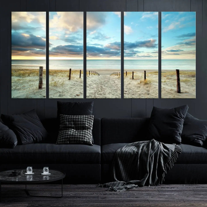 The Beach Ocean Sunset Sand Wall Art Canvas Print, renowned for its museum-quality and UV-protective coating, is elegantly displayed on a dark wall.