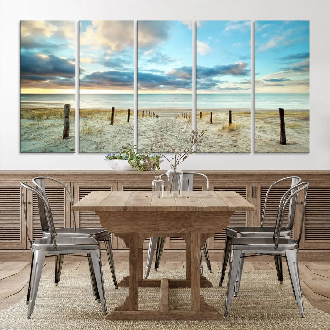 The Beach Ocean Sunset Sand Wall Art Canvas Print, renowned for its museum-quality and UV-protective coating, is elegantly displayed on a dark wall.