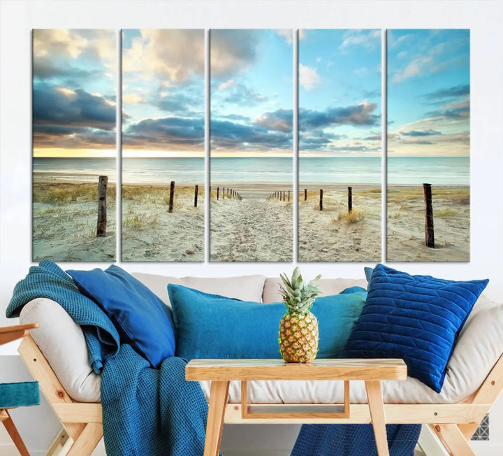 The Beach Ocean Sunset Sand Wall Art Canvas Print, renowned for its museum-quality and UV-protective coating, is elegantly displayed on a dark wall.