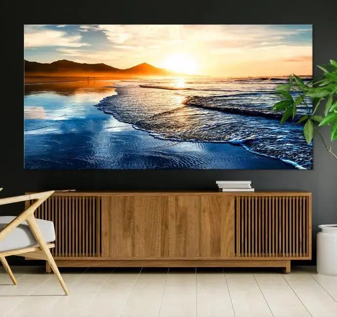 The Beach Ocean Sunset on the Sea Wall Art Canvas Print features a mesmerizing triptych of a beach sunset. Made from museum-quality polycotton canvas with a UV-protective coating, this ready-to-hang artwork will beautifully transform your space.