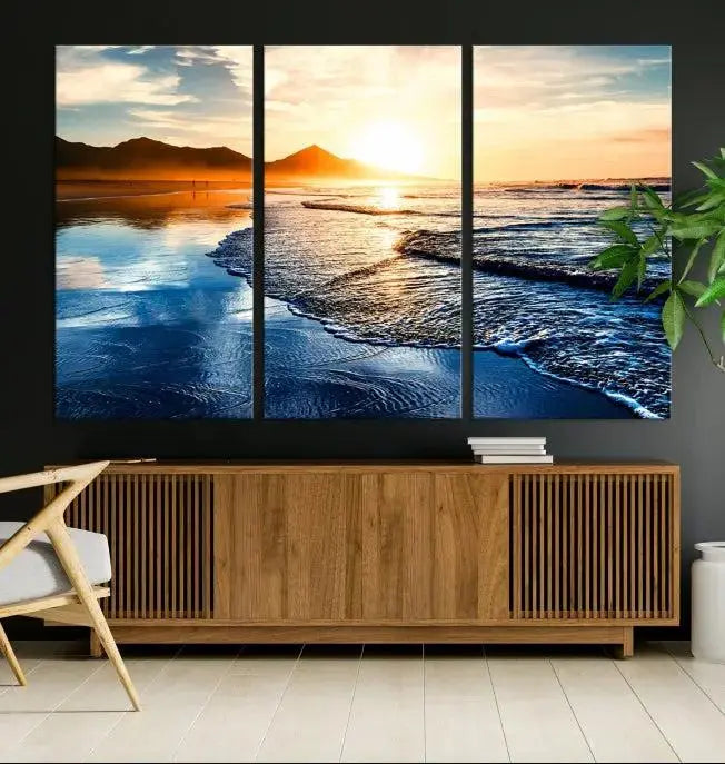 The Beach Ocean Sunset on the Sea Wall Art Canvas Print features a mesmerizing triptych of a beach sunset. Made from museum-quality polycotton canvas with a UV-protective coating, this ready-to-hang artwork will beautifully transform your space.