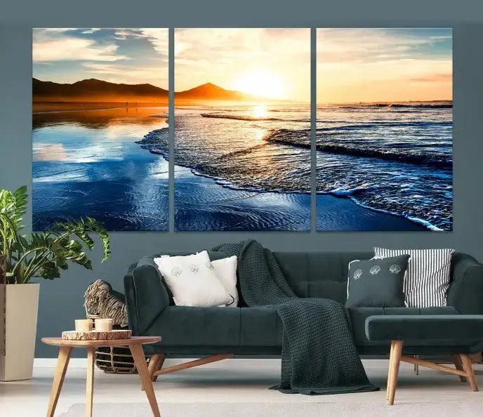 The Beach Ocean Sunset on the Sea Wall Art Canvas Print features a mesmerizing triptych of a beach sunset. Made from museum-quality polycotton canvas with a UV-protective coating, this ready-to-hang artwork will beautifully transform your space.