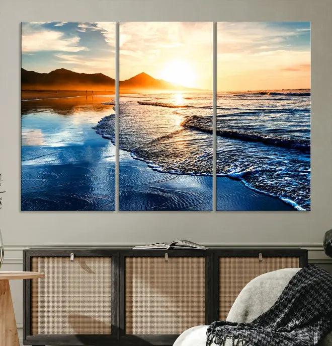 The Beach Ocean Sunset on the Sea Wall Art Canvas Print features a mesmerizing triptych of a beach sunset. Made from museum-quality polycotton canvas with a UV-protective coating, this ready-to-hang artwork will beautifully transform your space.