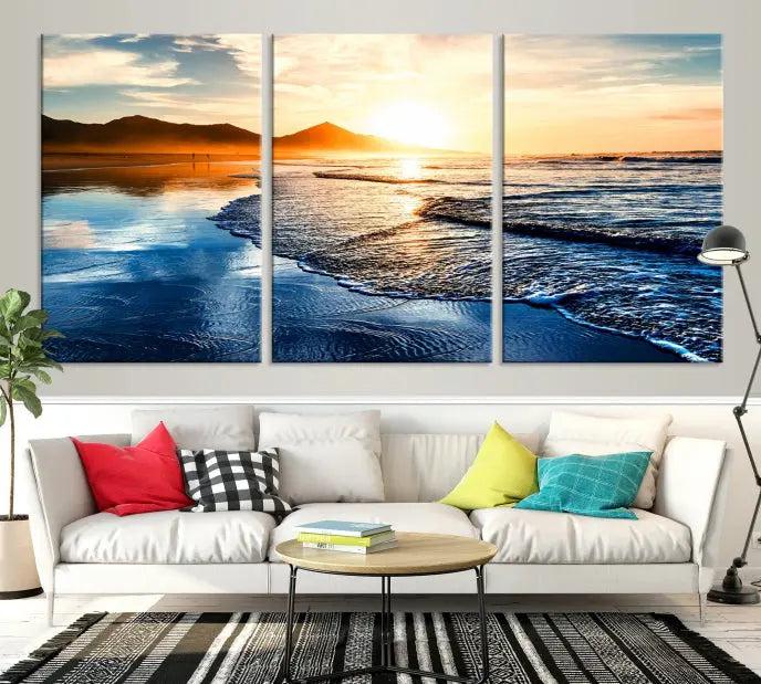 The Beach Ocean Sunset on the Sea Wall Art Canvas Print features a mesmerizing triptych of a beach sunset. Made from museum-quality polycotton canvas with a UV-protective coating, this ready-to-hang artwork will beautifully transform your space.