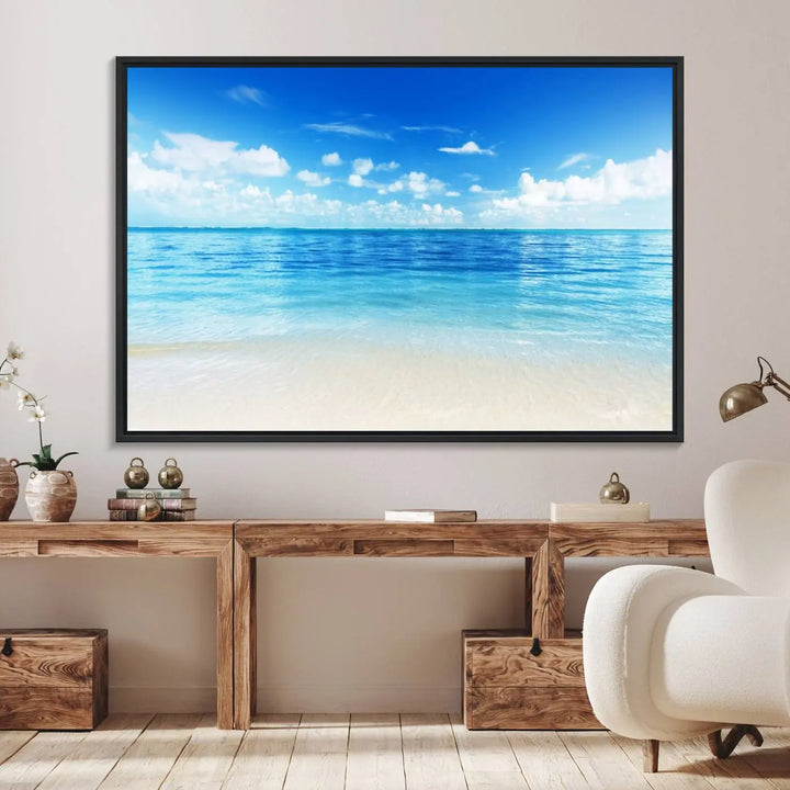 The living room features a beach scene wall art triptych.