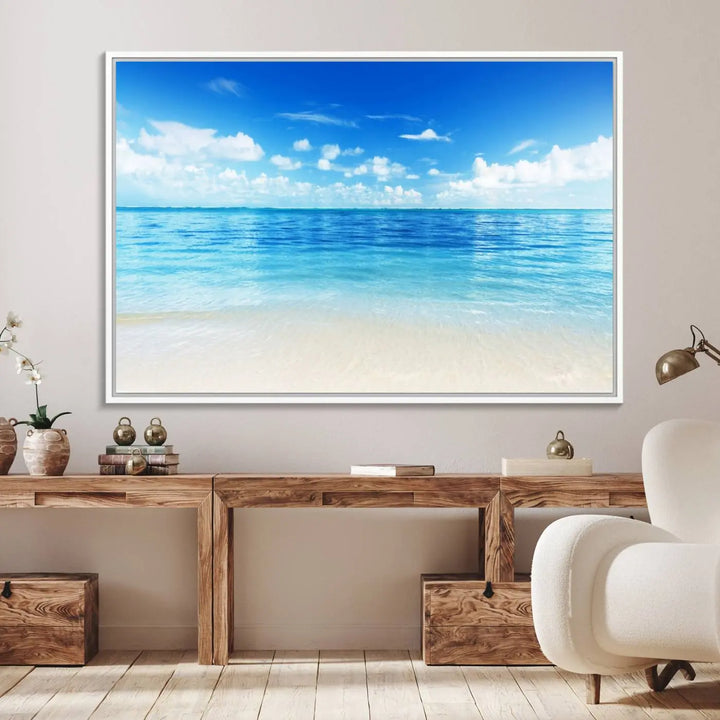 The living room features a beach scene wall art triptych.