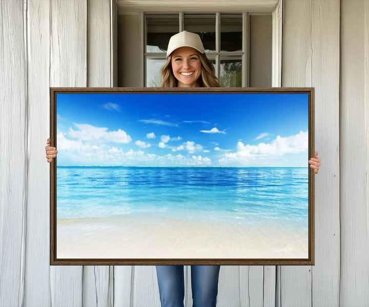 The living room features a beach scene wall art triptych.