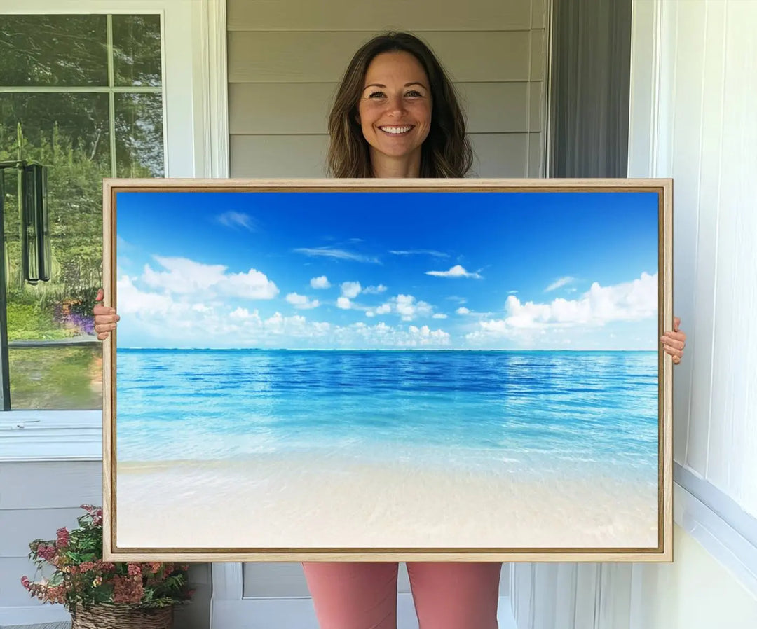 The living room features a beach scene wall art triptych.