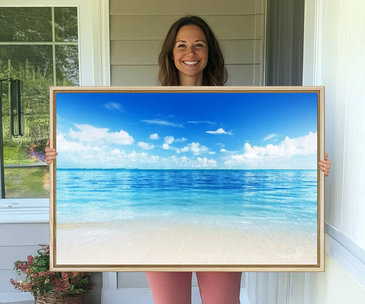 The living room features a beach scene wall art triptych.