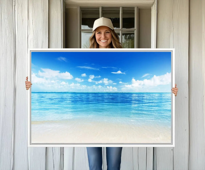 The living room features a beach scene wall art triptych.