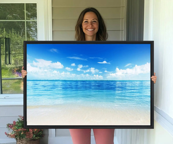 The living room features a beach scene wall art triptych.