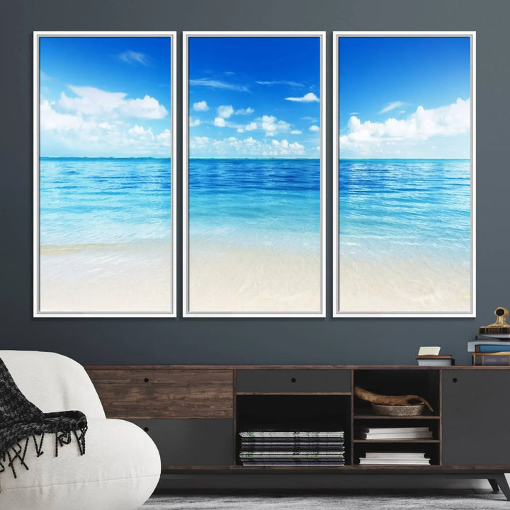 The living room features a beach scene wall art triptych.