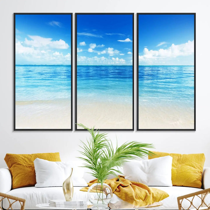 The living room features a beach scene wall art triptych.