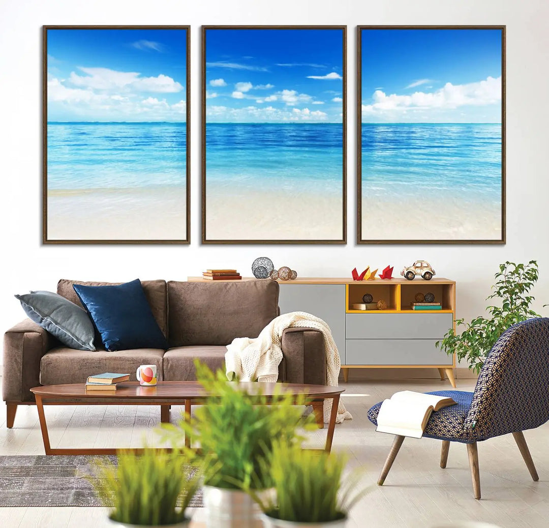 The living room features a beach scene wall art triptych.