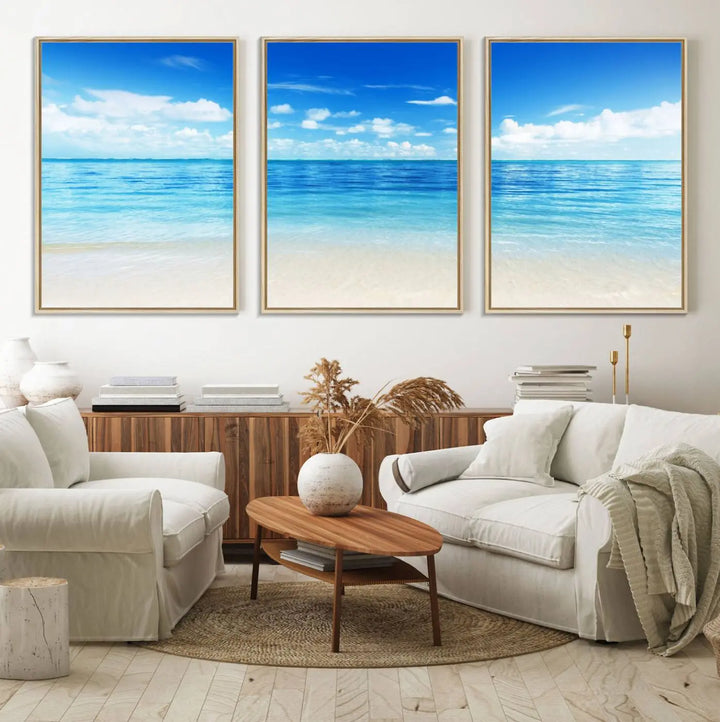 The living room features a beach scene wall art triptych.