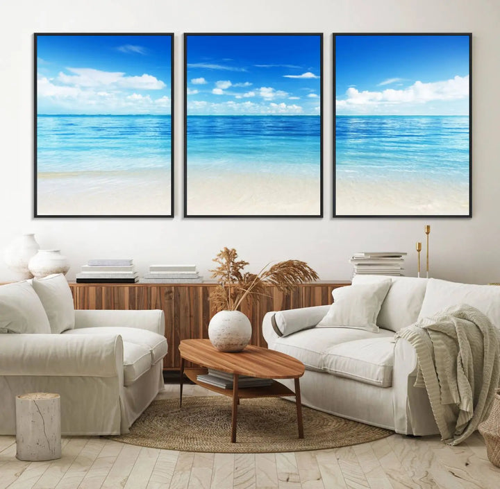 The living room features a beach scene wall art triptych.