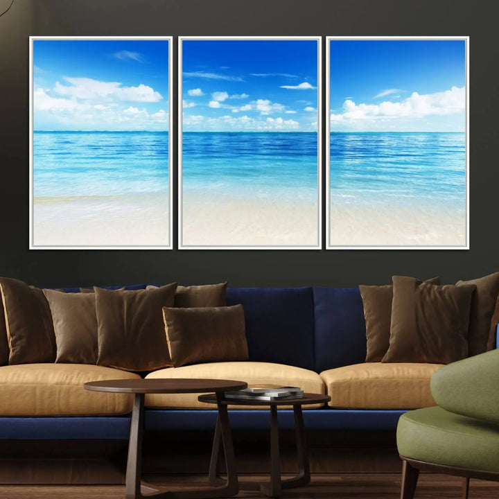 The living room features a beach scene wall art triptych.