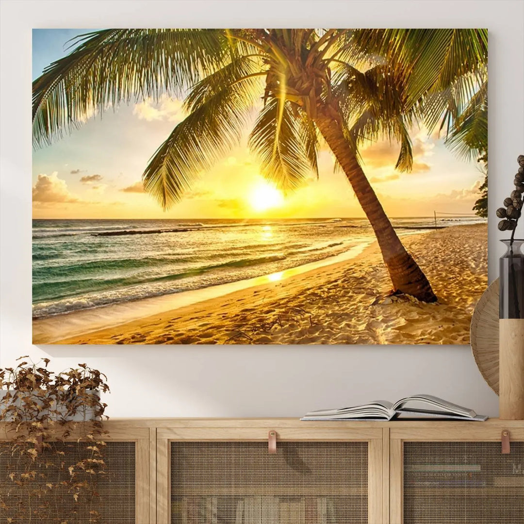 Beach Sunset Canvas Wall Art with a palm tree embellishes a living room with modern decor.