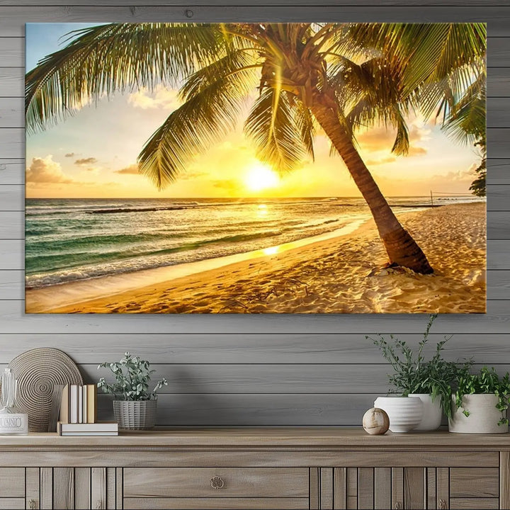 Beach Sunset Canvas Wall Art with a palm tree embellishes a living room with modern decor.