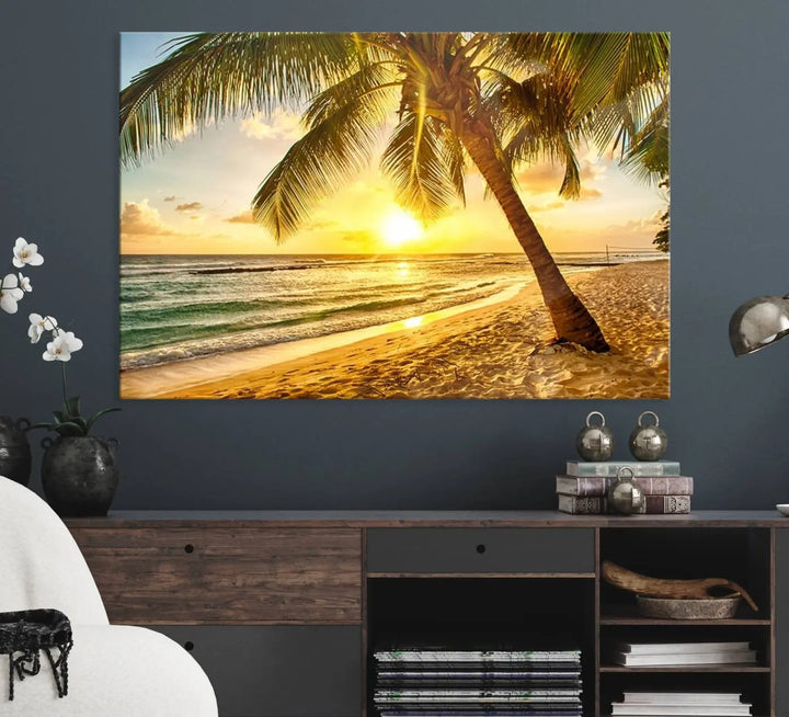 Beach Sunset Canvas Wall Art with a palm tree embellishes a living room with modern decor.