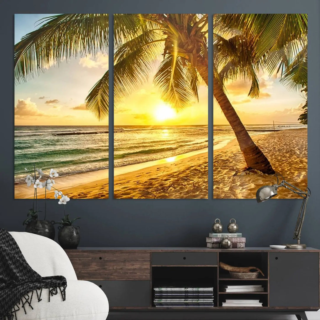 Beach Sunset Canvas Wall Art with a palm tree embellishes a living room with modern decor.