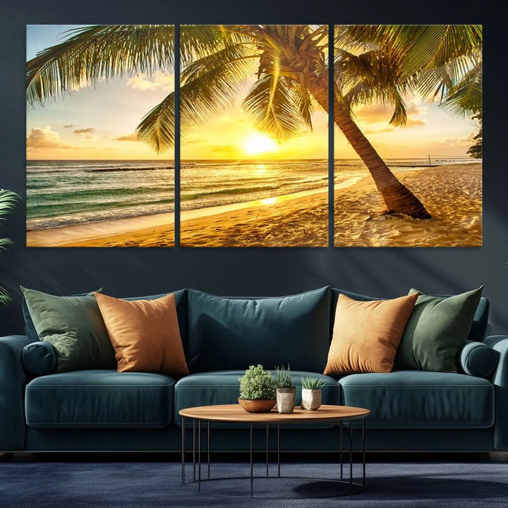 Beach Sunset Canvas Wall Art with a palm tree embellishes a living room with modern decor.