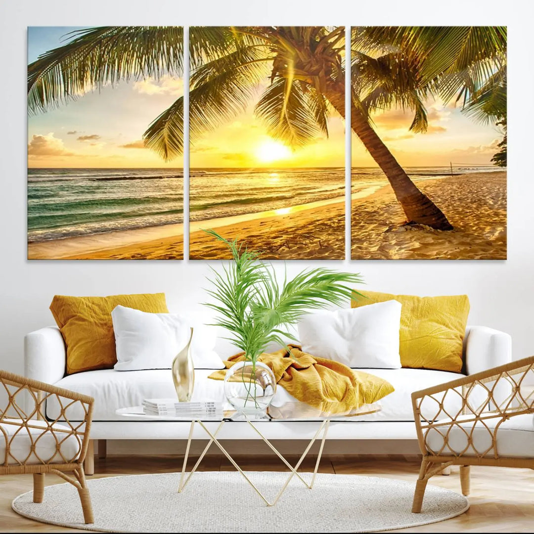 Beach Sunset Canvas Wall Art with a palm tree embellishes a living room with modern decor.