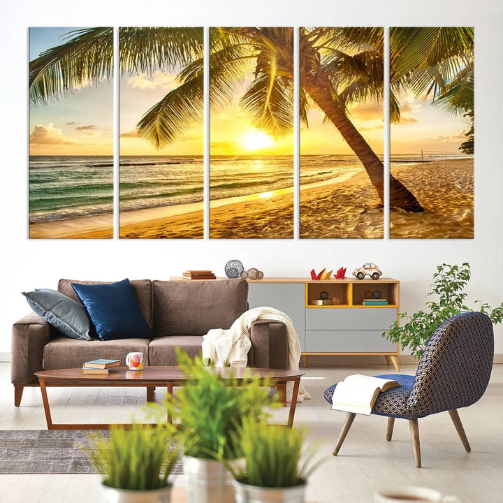 Beach Sunset Canvas Wall Art with a palm tree embellishes a living room with modern decor.