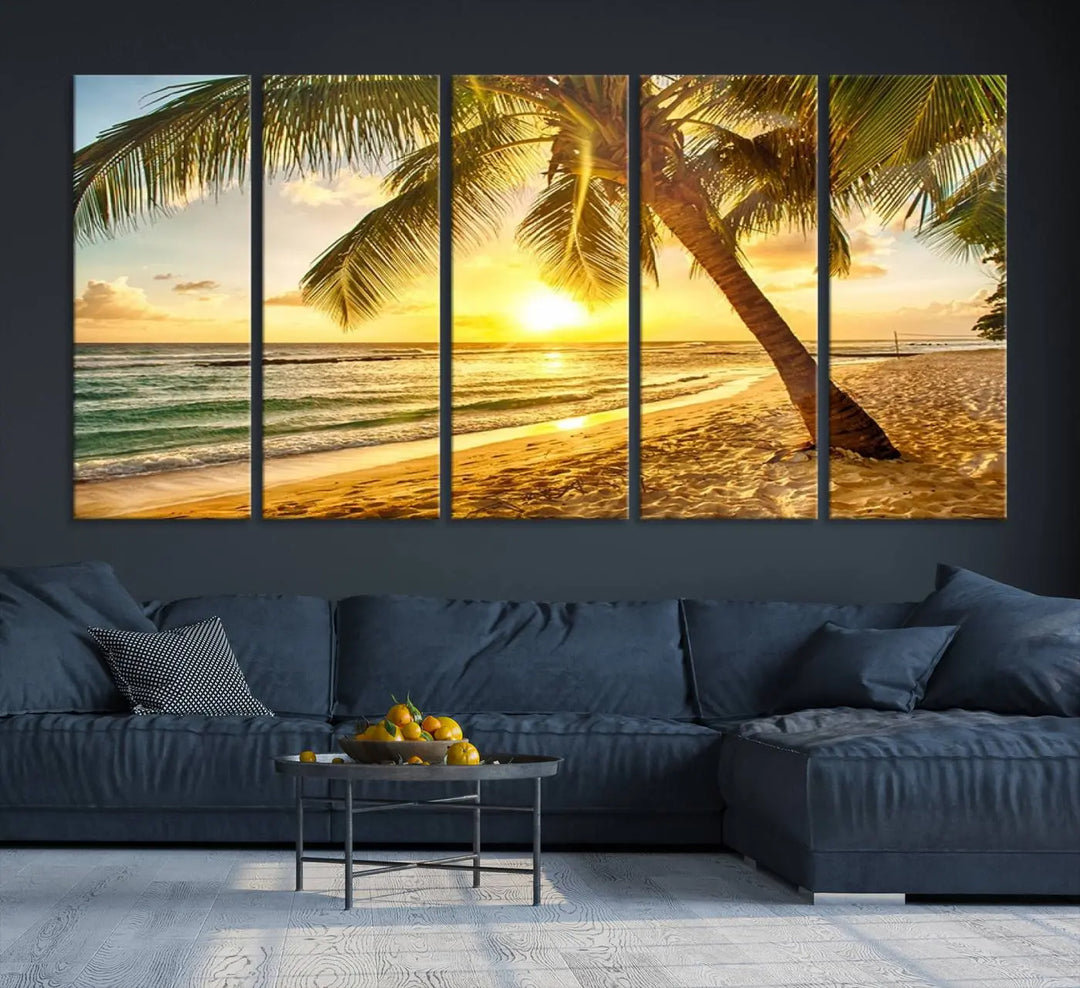 Beach Sunset Canvas Wall Art with a palm tree embellishes a living room with modern decor.