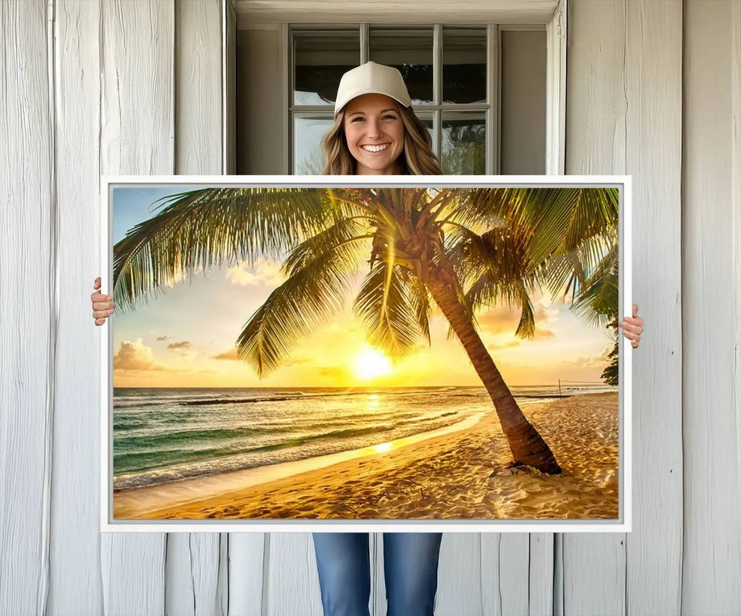 Beach Sunset Canvas Wall Art with a palm tree embellishes a living room with modern decor.