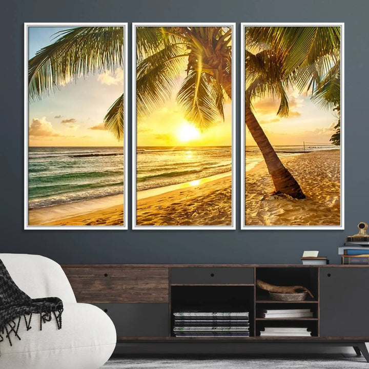 Beach Sunset Canvas Wall Art with a palm tree embellishes a living room with modern decor.