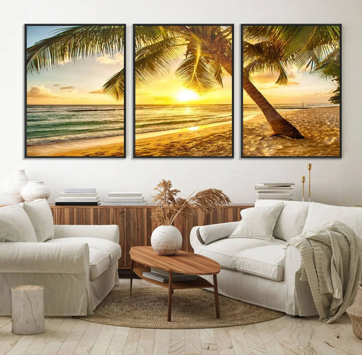 Beach Sunset Canvas Wall Art with a palm tree embellishes a living room with modern decor.