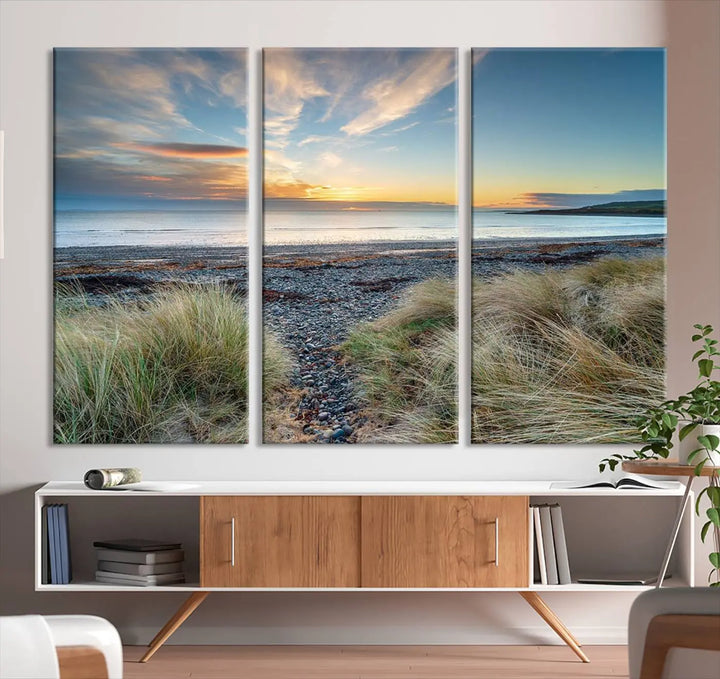 The living room features a Beach Sunset wall art canvas print gracing the wall, presented on museum-quality canvas with a UV-protective coating to ensure lasting vibrancy.