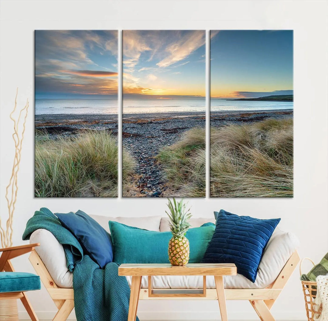 The living room features a Beach Sunset wall art canvas print gracing the wall, presented on museum-quality canvas with a UV-protective coating to ensure lasting vibrancy.