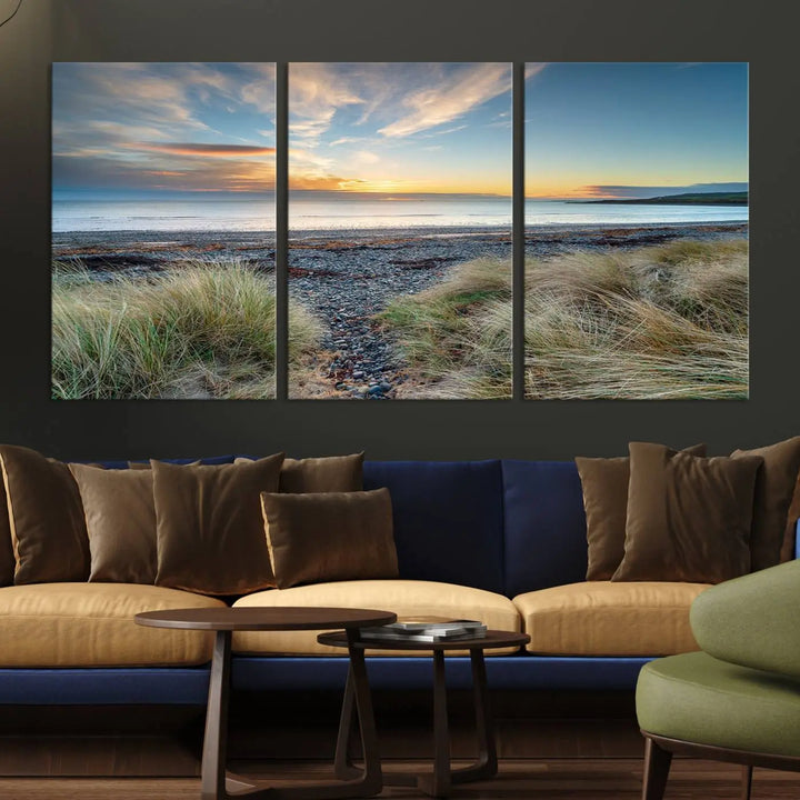 The living room features a Beach Sunset wall art canvas print gracing the wall, presented on museum-quality canvas with a UV-protective coating to ensure lasting vibrancy.