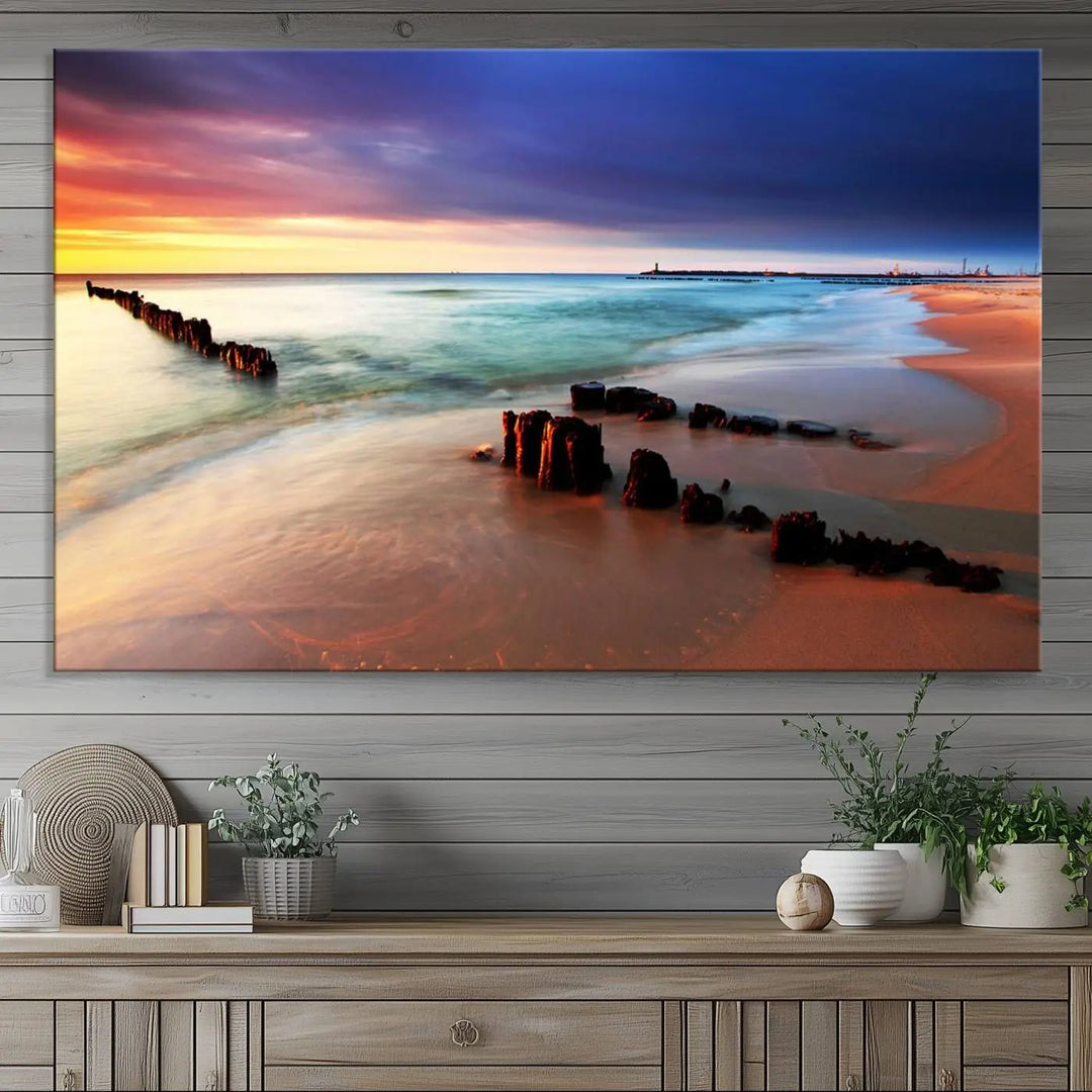 The gray wall in this living room is enhanced by a large beach triptych canvas wall art titled "Beach Sunset and Ocean Waves Canvas Wall Art, Set of 3, Seaside Serenity Coastal Decor," which captures the essence of a serene ocean scene.