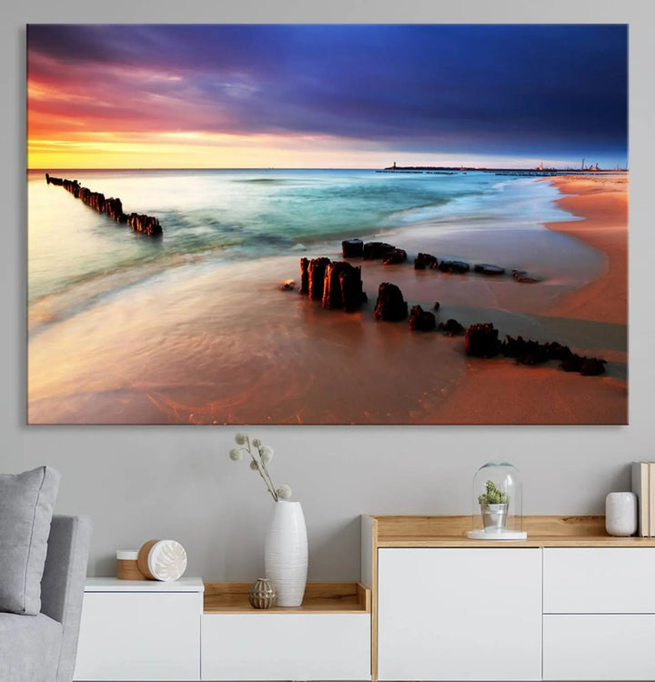 The gray wall in this living room is enhanced by a large beach triptych canvas wall art titled "Beach Sunset and Ocean Waves Canvas Wall Art, Set of 3, Seaside Serenity Coastal Decor," which captures the essence of a serene ocean scene.