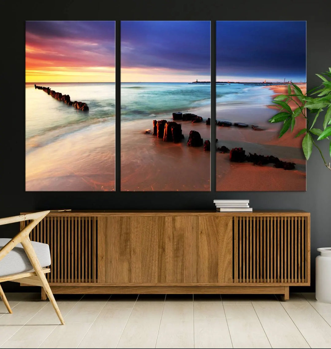 The gray wall in this living room is enhanced by a large beach triptych canvas wall art titled "Beach Sunset and Ocean Waves Canvas Wall Art, Set of 3, Seaside Serenity Coastal Decor," which captures the essence of a serene ocean scene.