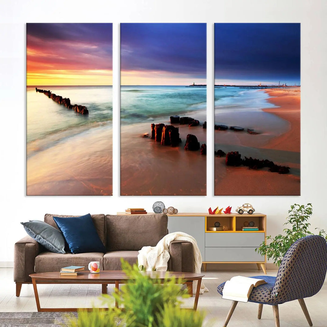 The gray wall in this living room is enhanced by a large beach triptych canvas wall art titled "Beach Sunset and Ocean Waves Canvas Wall Art, Set of 3, Seaside Serenity Coastal Decor," which captures the essence of a serene ocean scene.