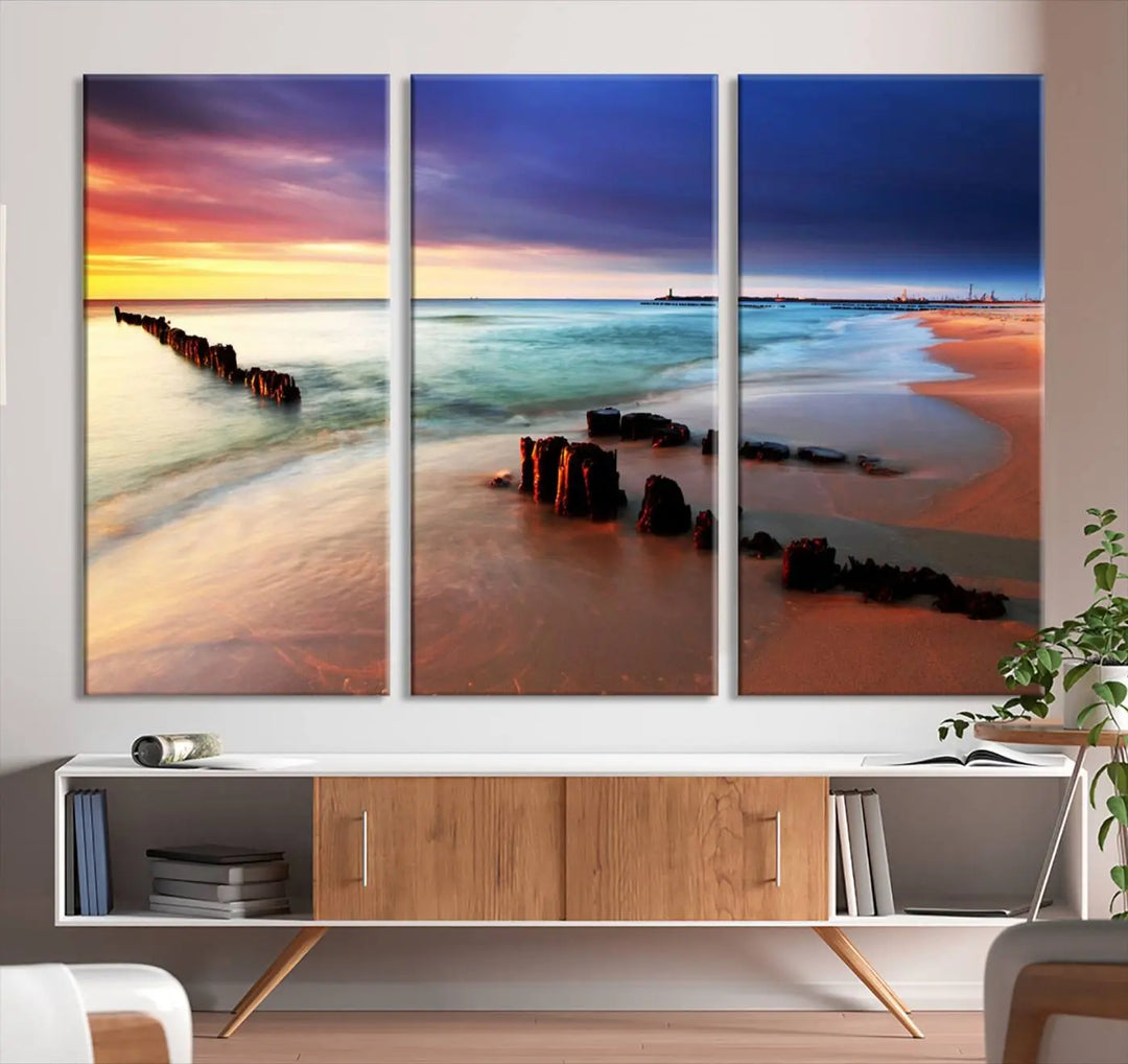 The gray wall in this living room is enhanced by a large beach triptych canvas wall art titled "Beach Sunset and Ocean Waves Canvas Wall Art, Set of 3, Seaside Serenity Coastal Decor," which captures the essence of a serene ocean scene.