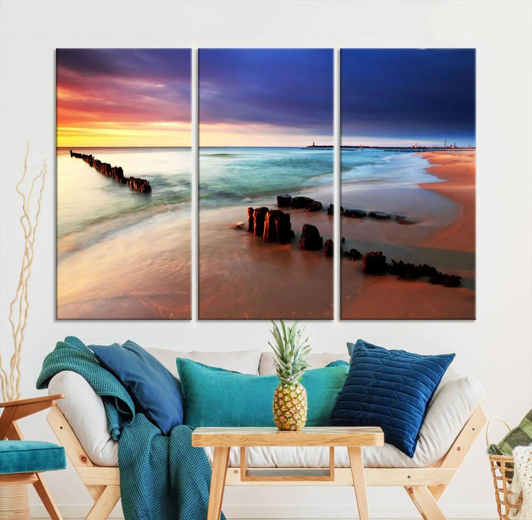 The gray wall in this living room is enhanced by a large beach triptych canvas wall art titled "Beach Sunset and Ocean Waves Canvas Wall Art, Set of 3, Seaside Serenity Coastal Decor," which captures the essence of a serene ocean scene.