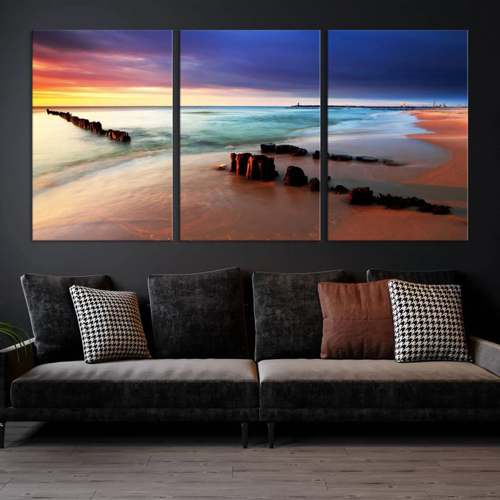 The gray wall in this living room is enhanced by a large beach triptych canvas wall art titled "Beach Sunset and Ocean Waves Canvas Wall Art, Set of 3, Seaside Serenity Coastal Decor," which captures the essence of a serene ocean scene.