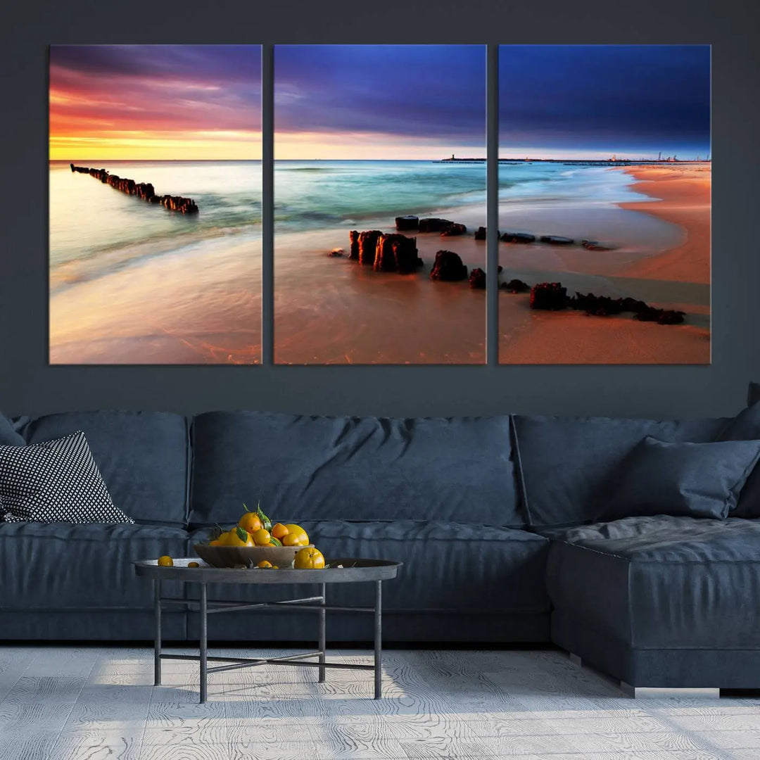 The gray wall in this living room is enhanced by a large beach triptych canvas wall art titled "Beach Sunset and Ocean Waves Canvas Wall Art, Set of 3, Seaside Serenity Coastal Decor," which captures the essence of a serene ocean scene.